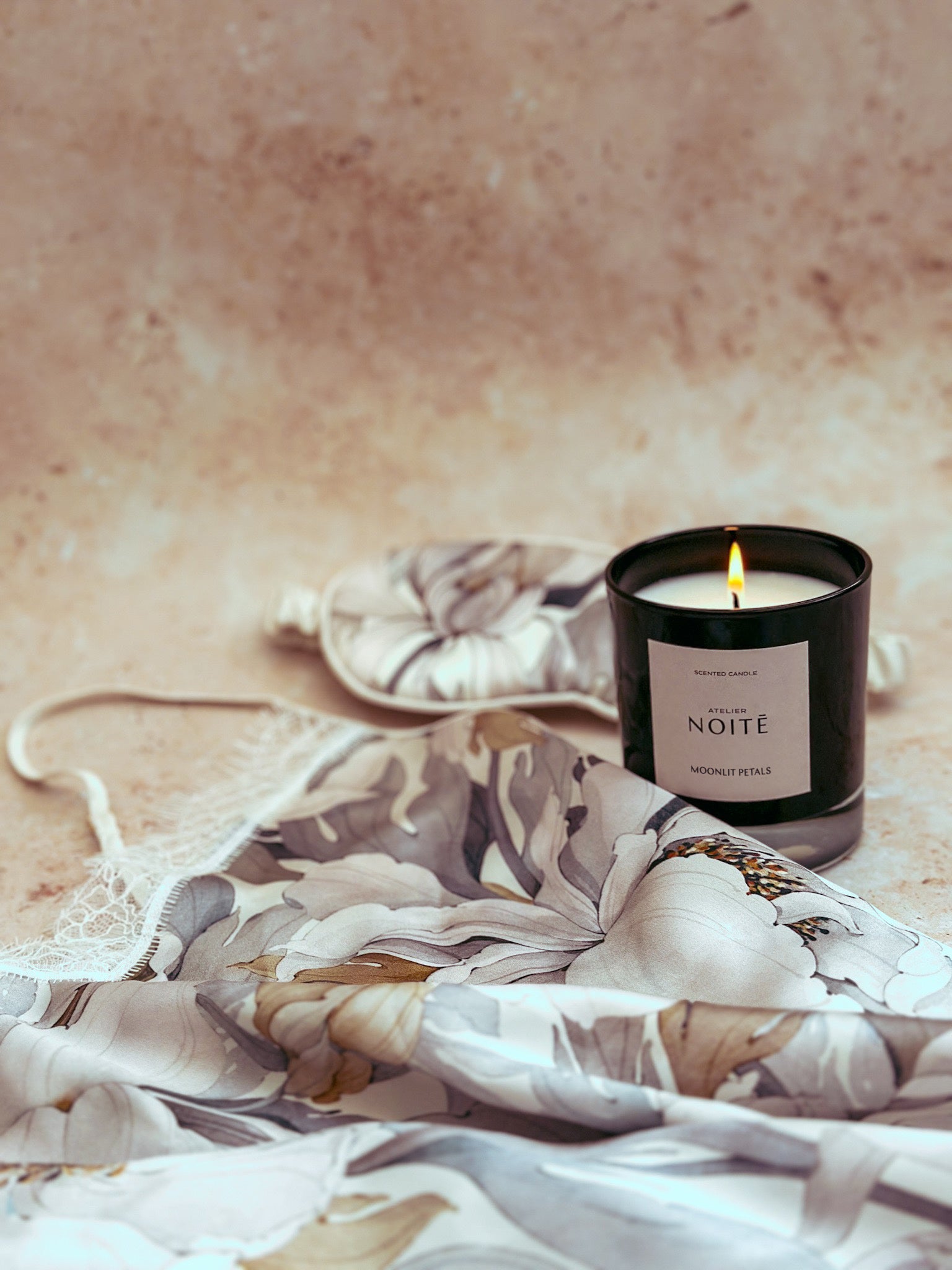 highly giftable duo of luxury scented candle with cream silk nightwear