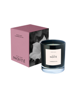 Black candle with 'Atelier Noité' label and pink packaging on a white background