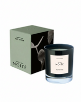 Candle with 'Atelier Noité' label and packaging on a white background