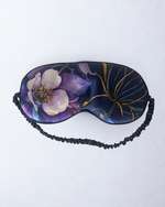 Floral patterned eye mask on a white background