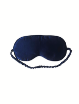 Navy blue satin eye mask on a white background